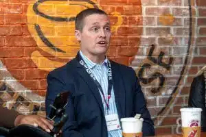 Resolution Promotions CEO John Archibald speaks at an NJ Devils Buy Black marketing event at LeGrand Coffee House.