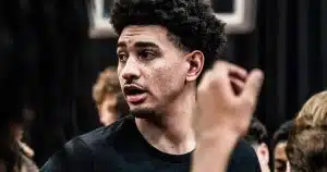 Former Rutgers Basketball captain Geo Baker speaks to a group of youth players.