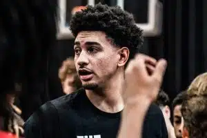 Former Rutgers Basketball captain Geo Baker speaks to a group of youth players.