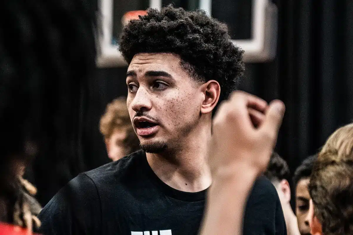 Former Rutgers Basketball captain Geo Baker speaks to a group of youth players.