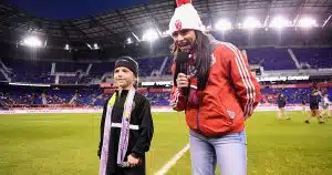 A youth player is honored on the field at Red Bull Arena for scoring the New Jersey Youth Soccer Goal of the Year.